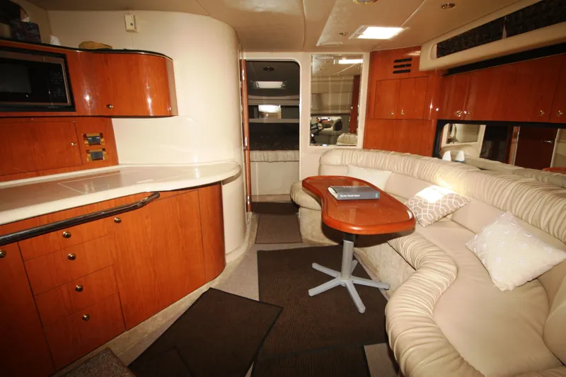 Slide: The Image of Luxurious interior of 1999 Sea Ray 380 Sundancer yacht with elegant seating and cabinetry. - 45