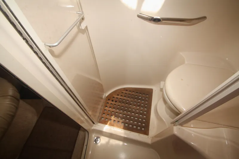 Slide: The Image of Bathroom interior of 1999 Sea Ray 380 Sundancer yacht, featuring shower and toilet. - 59