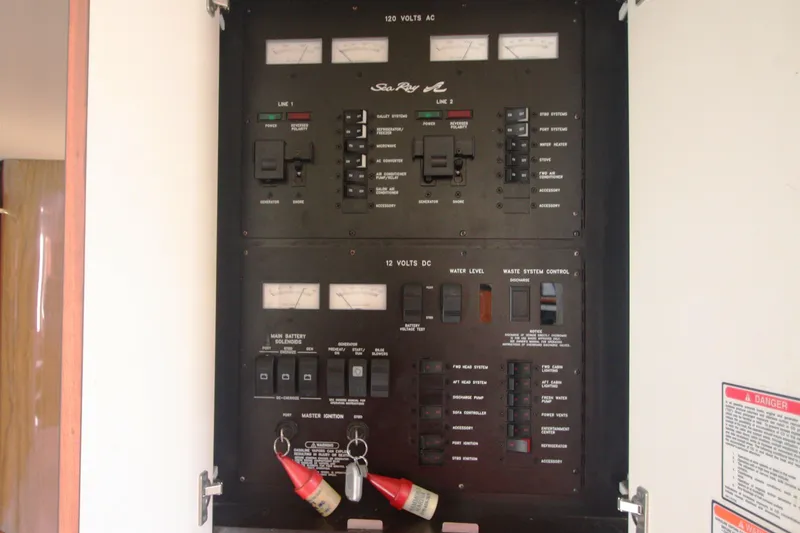 Slide: The Image of Electrical control panel of a 1999 Sea Ray 380 Sundancer boat. - 68