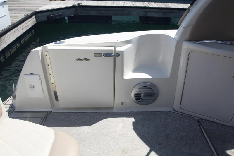 Slide: The Image of 1999 Sea Ray 380 Sundancer boat interior with seating and storage compartments. - 17