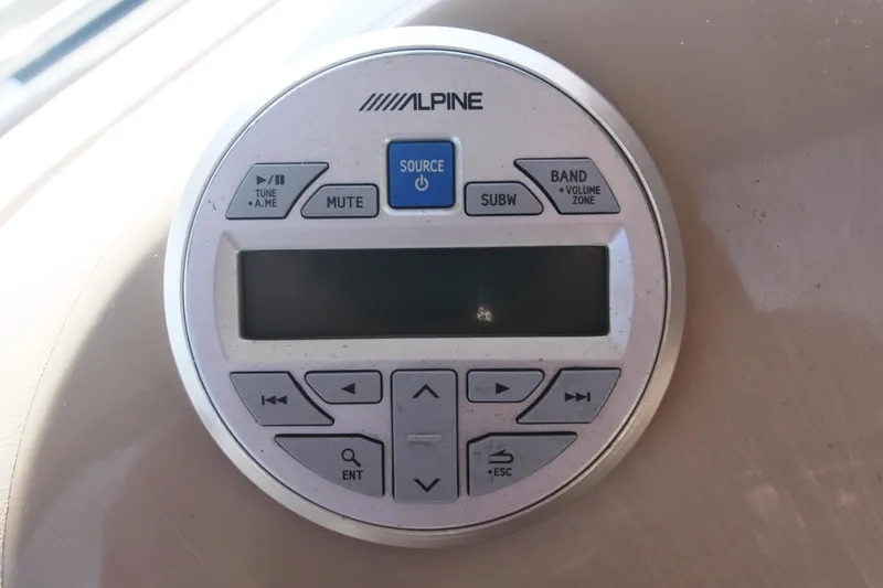 Slide: The Image of Alpine audio control panel on 1999 Sea Ray 380 Sundancer boat dashboard. - 43