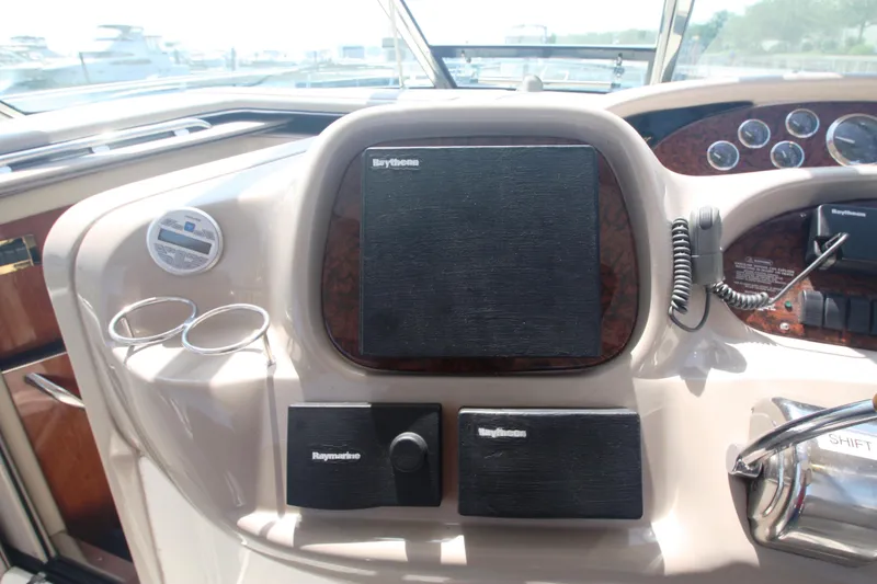 Slide: The Image of Control panel of a 1999 Sea Ray 380 Sundancer boat with navigation equipment. - 42