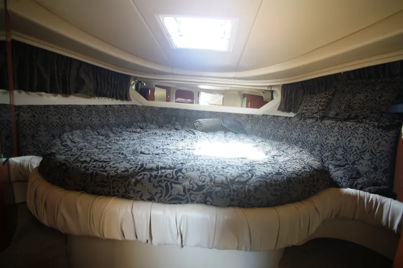 Slide: The Image of Luxurious cabin interior of 1999 Sea Ray 380 Sundancer yacht with elegant bedding. - 53