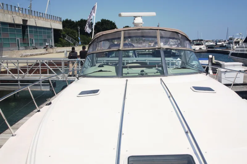 Slide: The Image of 1999 Sea Ray 380 Sundancer yacht docked at a marina on a sunny day. - 20