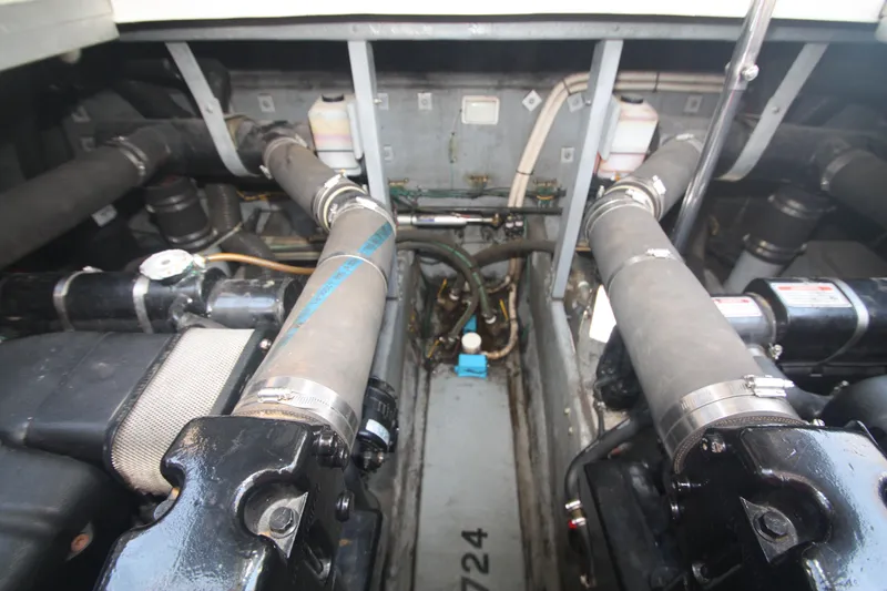 Slide: The Image of Engine compartment of a 1999 Sea Ray 380 Sundancer boat, showcasing mechanical components. - 65