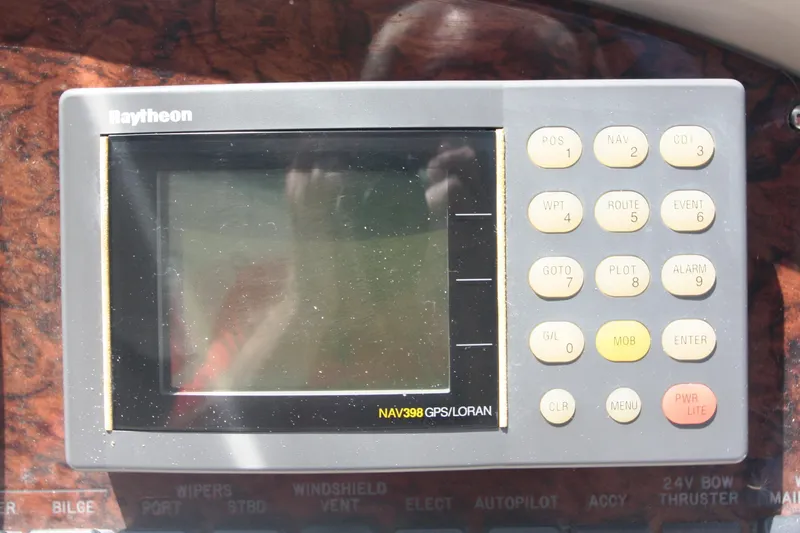 Slide: The Image of Raytheon NAV398 GPS/LORAN system on 1999 Sea Ray 380 Sundancer boat dashboard. - 40