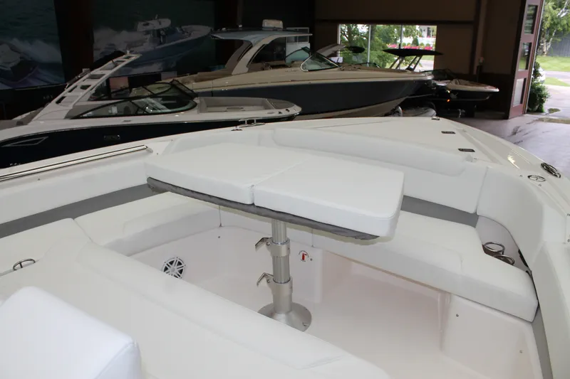 Slide: The Image of 2027 Tiara Yachts 46 LS luxury boat interior with white seating and table. - 13