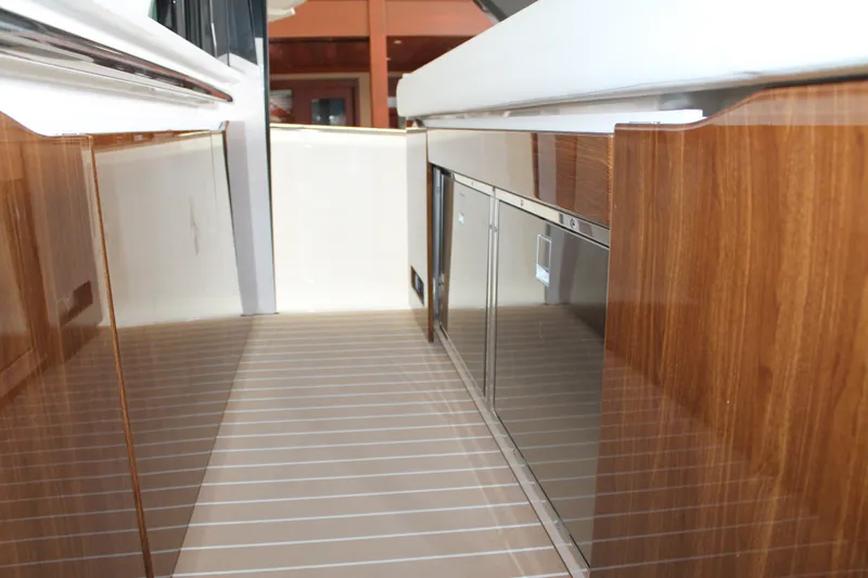 Slide: The Image of Luxurious interior of 2027 Tiara Yachts 46 LS, featuring sleek wood finishes and modern design. - 5