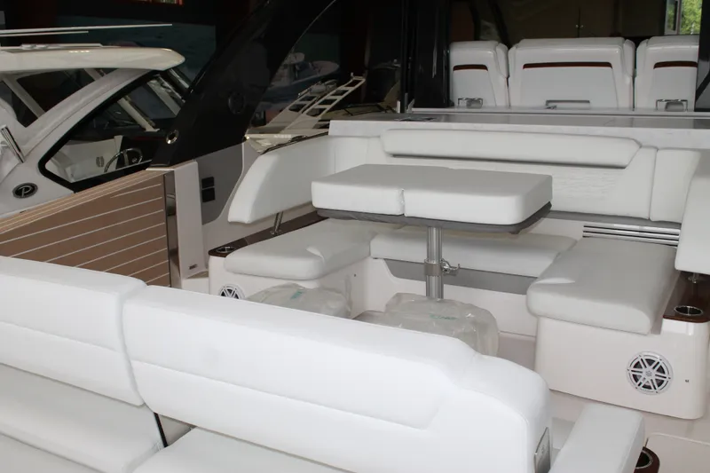 Slide: The Image of Luxurious seating area on a 2027 Tiara Yachts 46 LS, featuring elegant white upholstery. - 2