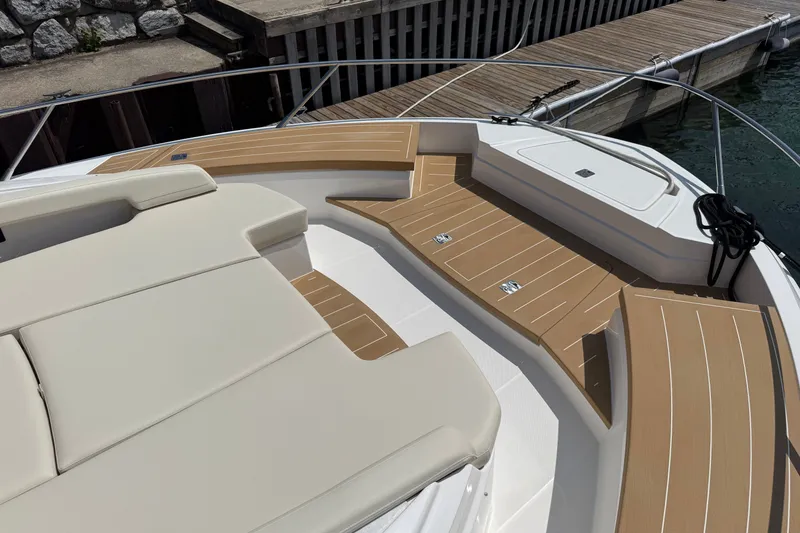 Slide: The Image of Luxurious 2027 Tiara Yachts EX 54 deck with elegant seating and wood accents. - 45