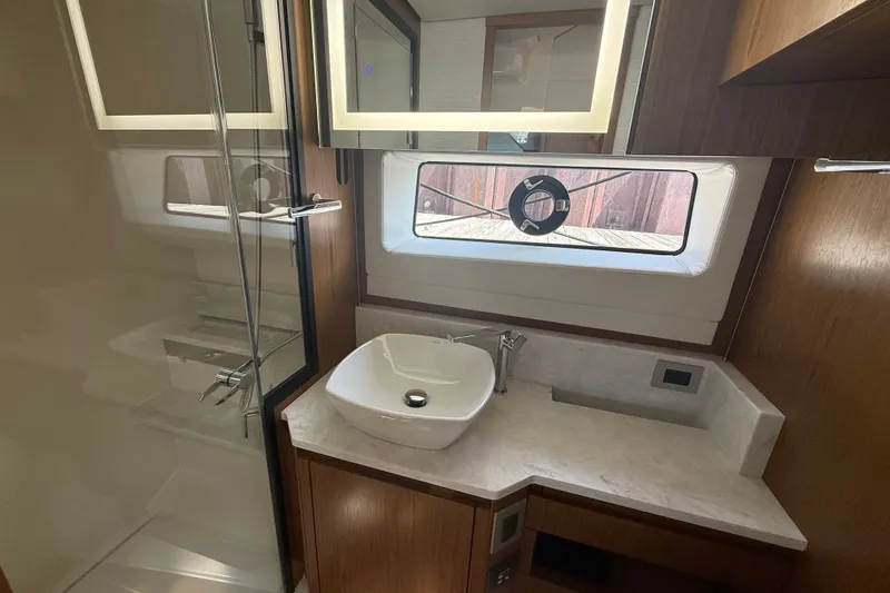 Slide: The Image of Luxurious bathroom in 2027 Tiara Yachts EX 54 with modern fixtures and elegant design. - 40