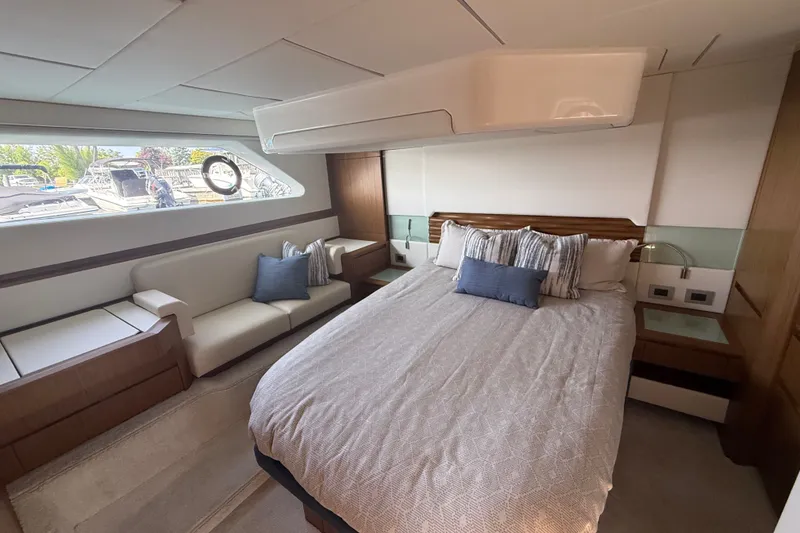 Slide: The Image of Luxurious bedroom interior of 2027 Tiara Yachts EX 54, featuring elegant bedding and modern design. - 36