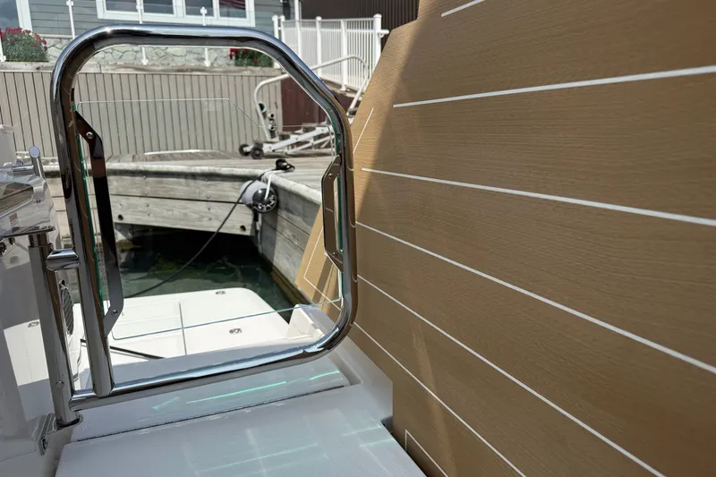 Slide: The Image of Tiara Yachts EX 54, 2027 model, docked with sleek design and modern railing. - 58