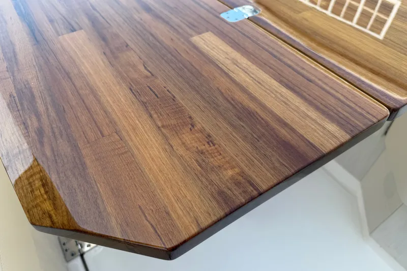 Slide: The Image of Wooden table detail on 2027 Tiara Yachts EX 54, showcasing elegant craftsmanship. - 56