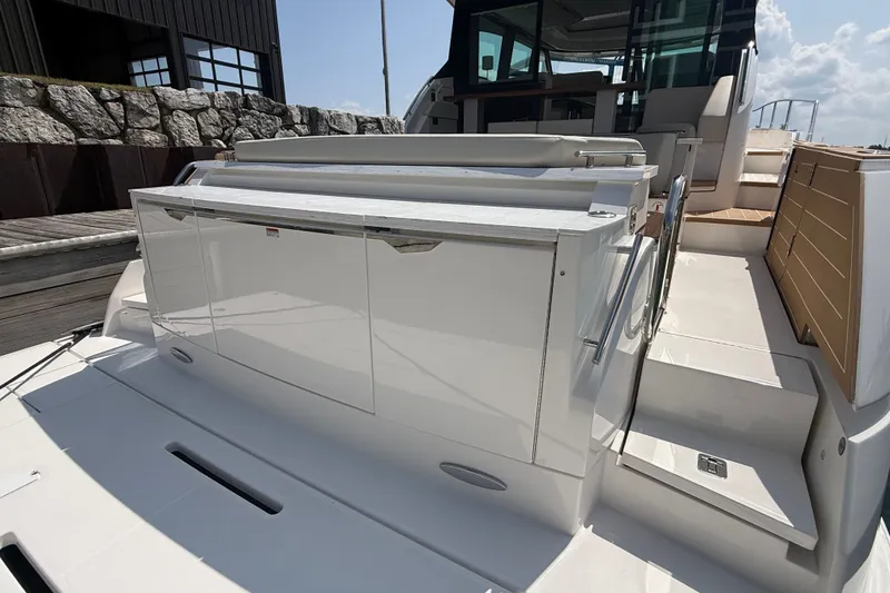 Slide: The Image of 2027 Tiara Yachts EX 54 luxury yacht deck with sleek design and modern amenities. - 49
