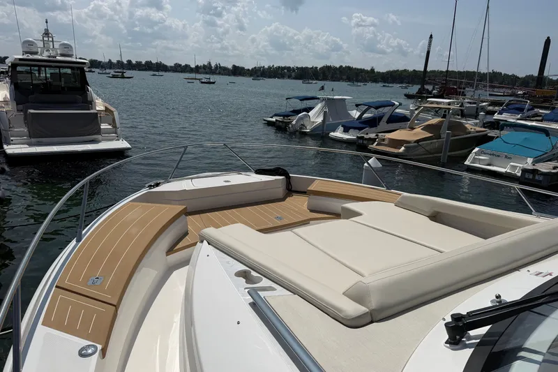 Slide: The Image of Luxurious 2027 Tiara Yachts EX 54 docked, featuring spacious sunbathing deck. - 42