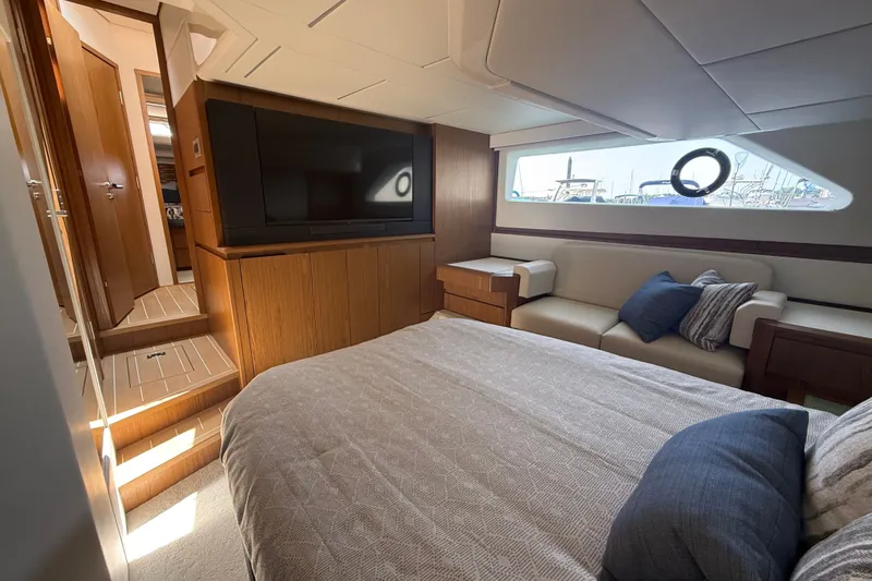 Slide: The Image of Luxurious interior of 2027 Tiara Yachts EX 54 with cozy bedroom and modern amenities. - 38