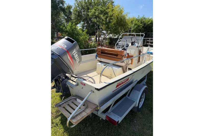 Slide: The Image of 1987 Boston Whaler 17 Montauk boat with Yamaha outboard motor on trailer. - 6