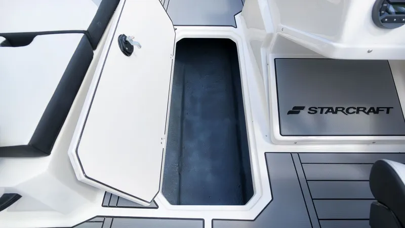 Slide: The Image of The image shows the interior of a Starcraft SV 18 OB boat with storage space. - 11