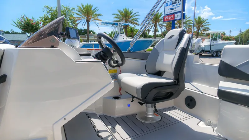 Slide: The Image of The image shows the cockpit of a Starcraft SV 18 OB boat with a modern seat and steering. - 15