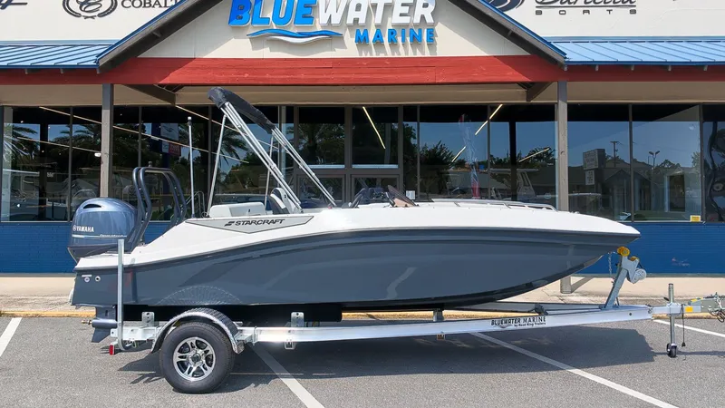 Slide: The Image of A 2027 Starcraft SV 18 OB boat on a trailer in front of a building. - 16