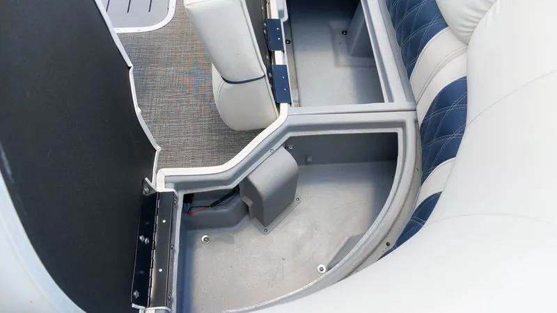 Slide: The Image of Interior of a Bennington 25 QFBA boat with blue and white upholstery. - 20