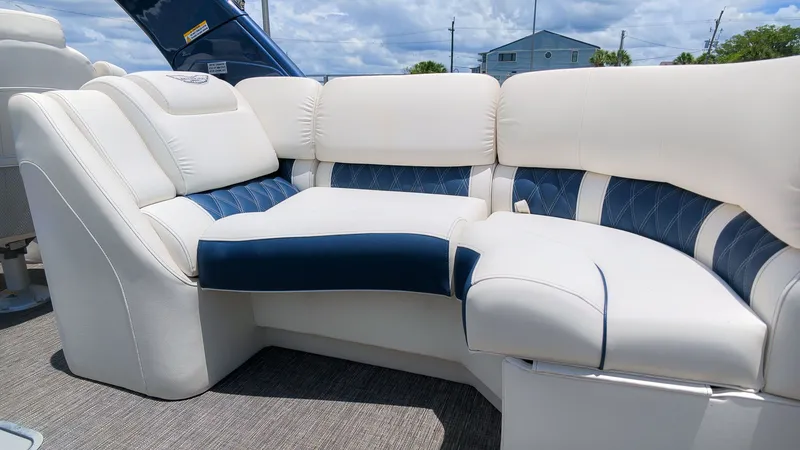 Slide: The Image of Luxurious white and blue seating area on a Bennington 25 QFBA pontoon boat. - 9