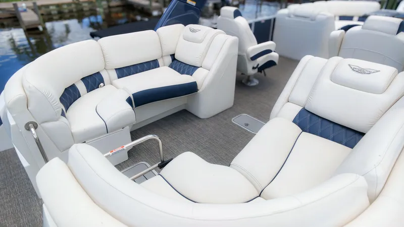 Slide: The Image of Luxurious white and blue seating on a boat docked at the marina. - 7