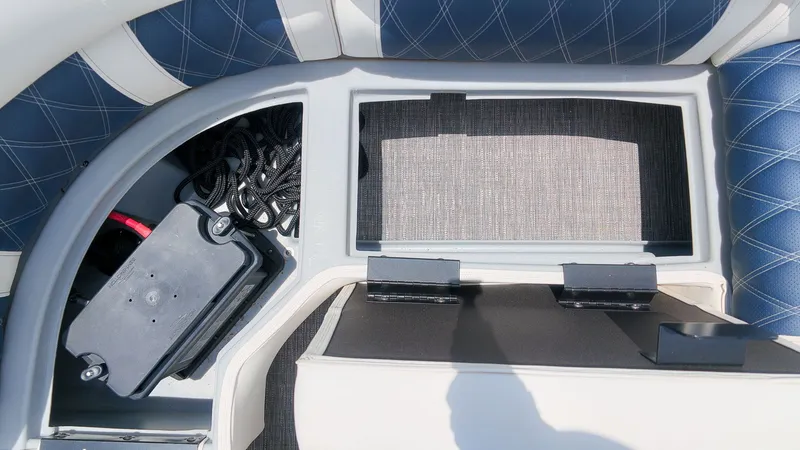 Slide: The Image of Close-up of a seating area with storage and blue upholstery. - 11