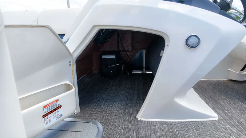 Slide: The Image of Interior view of a boat with storage space under the helm. - 24