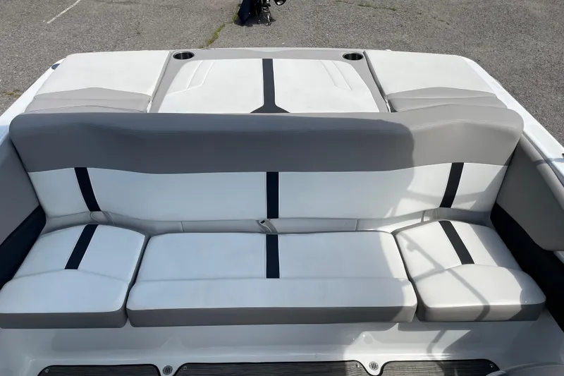 Slide: The Image of 2020 Four Winns H190 boat interior with gray and white seating, featuring cup holders. - 14