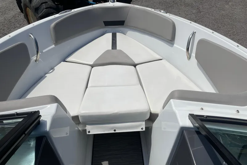 Slide: The Image of 2020 Four Winns H190 boat interior with cushioned seating and sleek design. - 10