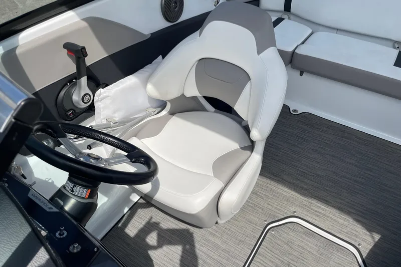 Slide: The Image of Interior of 2020 Four Winns H190 boat with steering wheel and seating. - 3