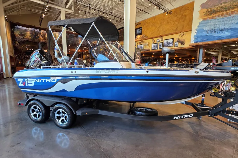 Slide: The Image of 2026 Nitro ZV19 Sport Pro boat displayed indoors on a trailer. - 63