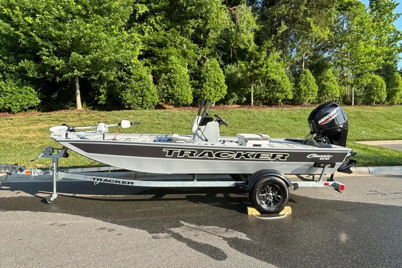 The Image of 2026 Tracker Bass Tracker Classic CC boat on trailer, parked on a sunny day. - 0