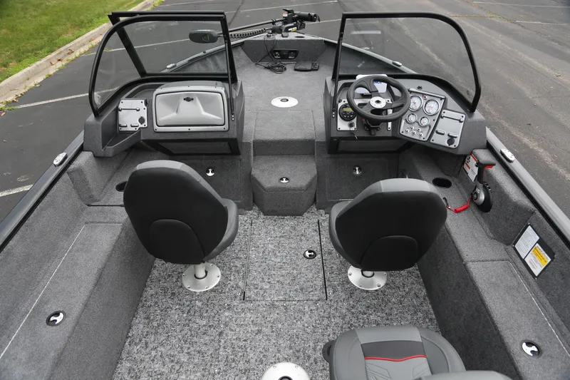 Slide: The Image of Interior view of a 2026 Tracker Pro Guide V-175 WT with two seats and a control console. - 4