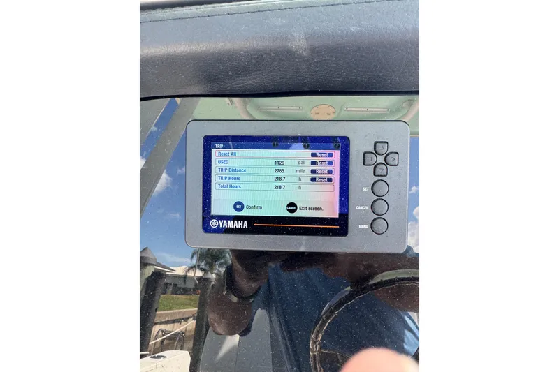 Slide: The Image of Yamaha display on 2021 Robalo R230 Center Console showing trip data and settings. - 15