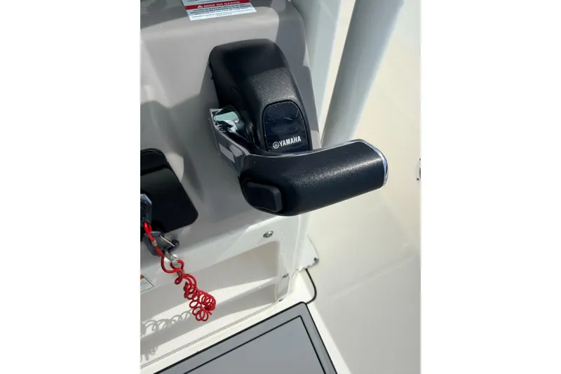 Slide: The Image of Throttle control of 2021 Robalo R230 Center Console boat with Yamaha branding. - 18