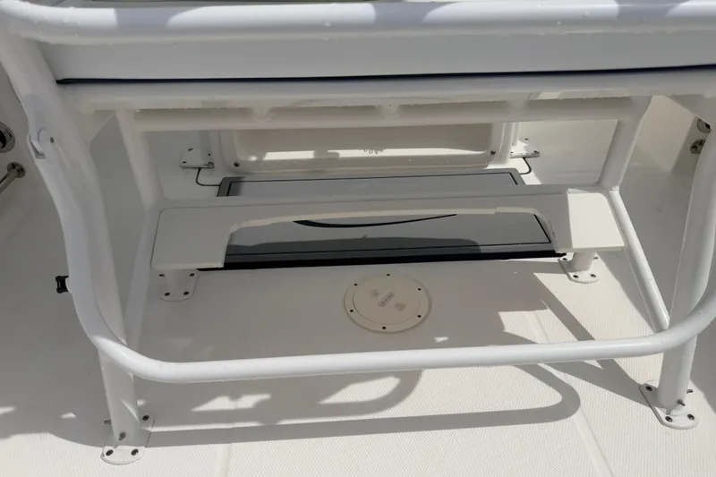 Slide: The Image of 2021 Robalo R230 Center Console boat interior detail, featuring seating and storage area. - 28