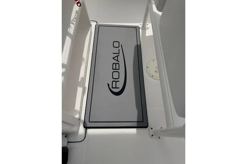 Slide: The Image of 2021 Robalo R230 Center Console boat deck with branded mat. - 17