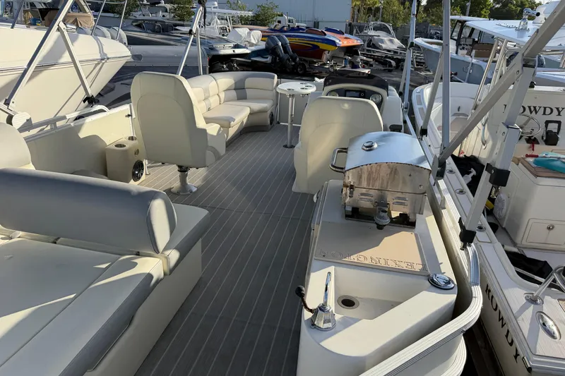 Slide: The Image of Luxurious 2021 Lexington 521 5 Series pontoon boat with spacious seating and sleek design. - 9