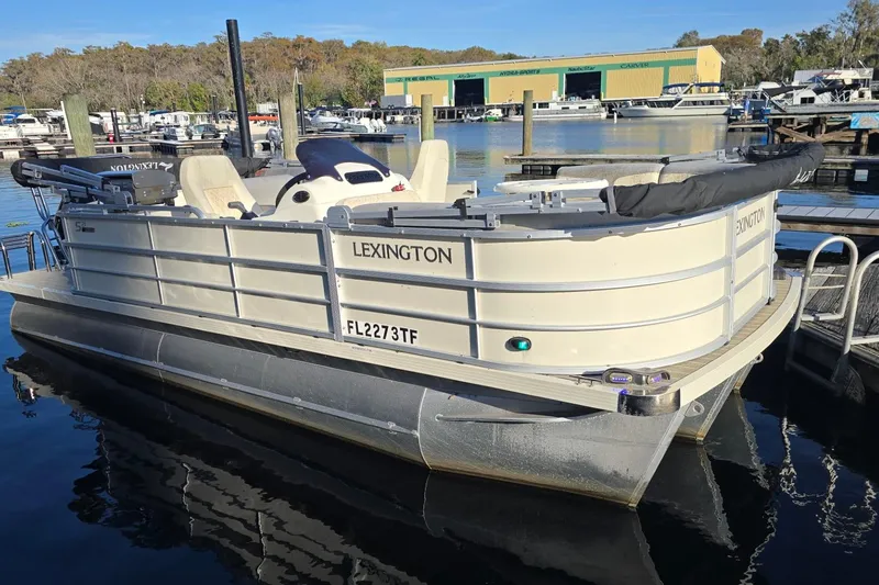 The Image of 2021 Lexington 521 5 Series pontoon boat docked at marina. - 0