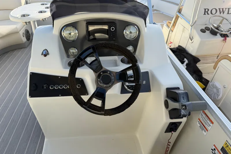 Slide: The Image of Steering console of a 2021 Lexington 521 5 series boat with modern controls. - 6