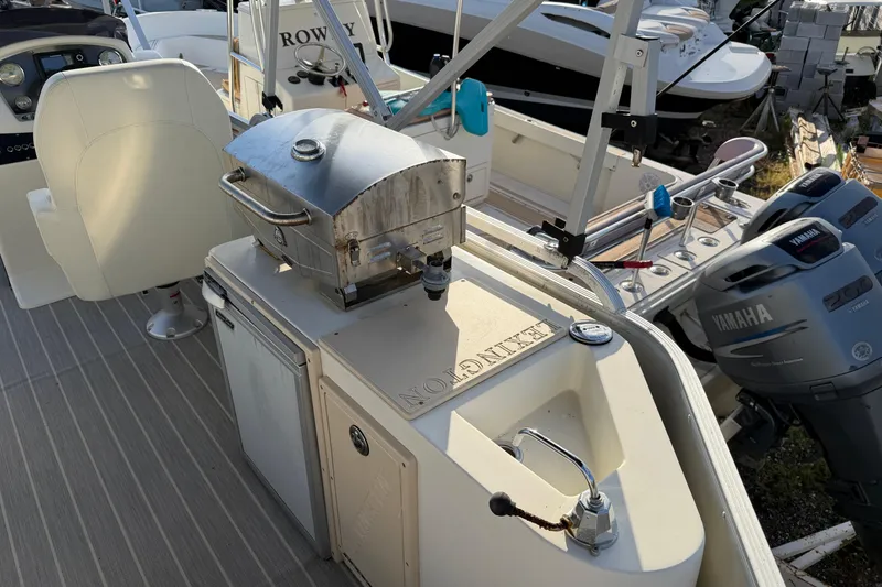 Slide: The Image of Pontoon boat with grill, sink, and Yamaha engines, Lexington 521 5 series, 2021 model. - 4