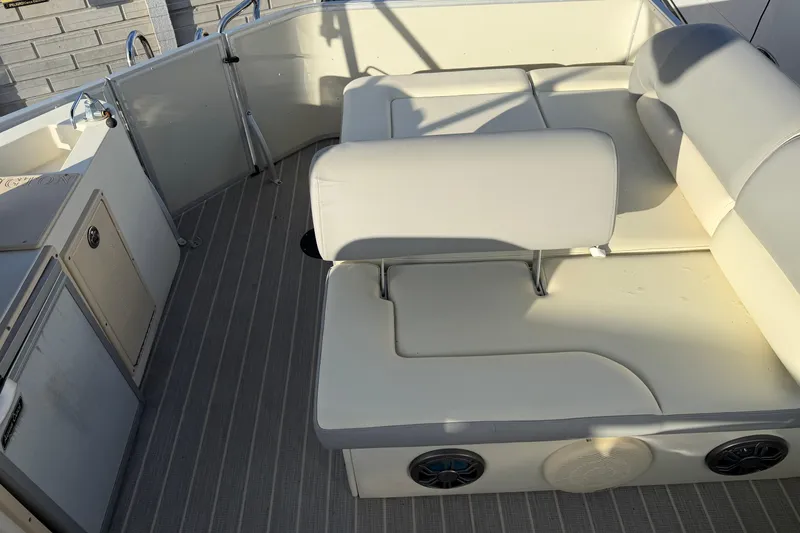 Slide: The Image of Luxurious seating area on a 2021 Lexington 521 5 series boat, featuring plush cushions. - 12