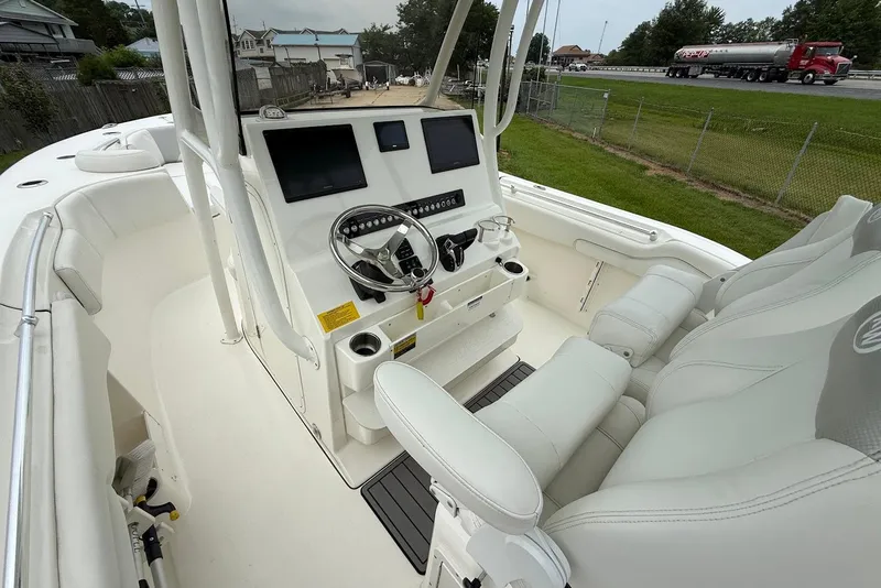 Slide: The Image of 2023 Key West 263 FS boat interior with modern helm and seating. - 12