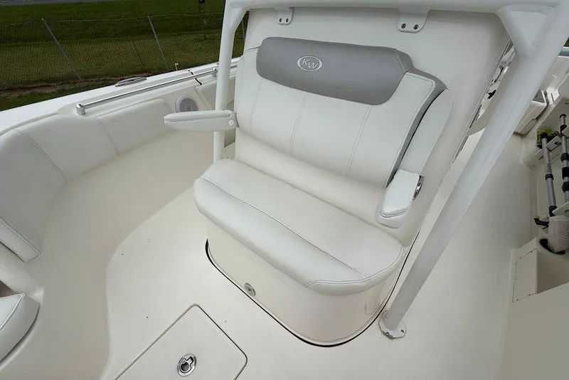 Slide: The Image of 2023 Key West 263 FS boat interior with white cushioned seating and armrests. - 21