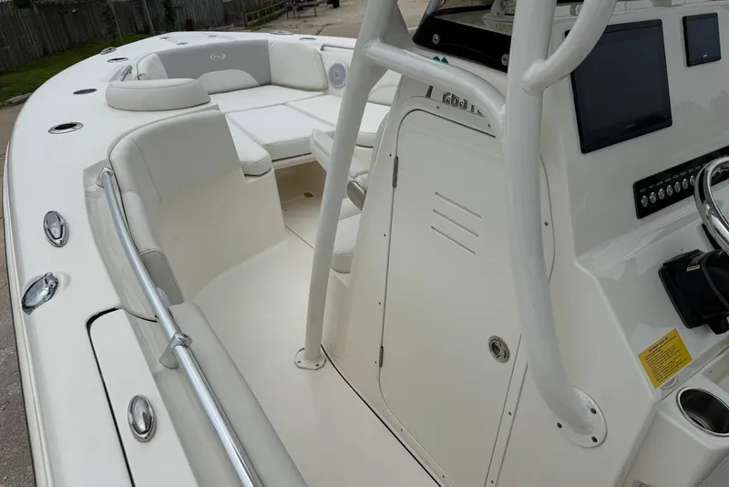 Slide: The Image of 2023 Key West 263 FS boat interior with seating and control panel. - 18