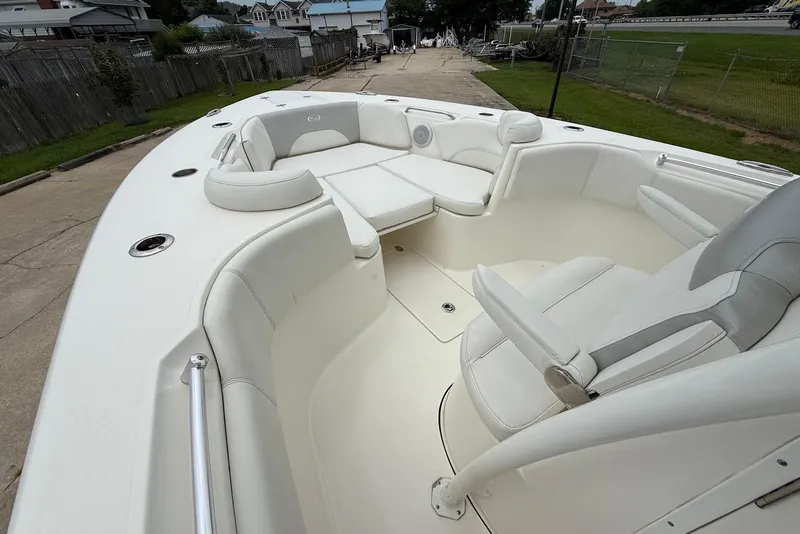 Slide: The Image of 2023 Key West 263 FS boat interior with white seating and spacious layout. - 20