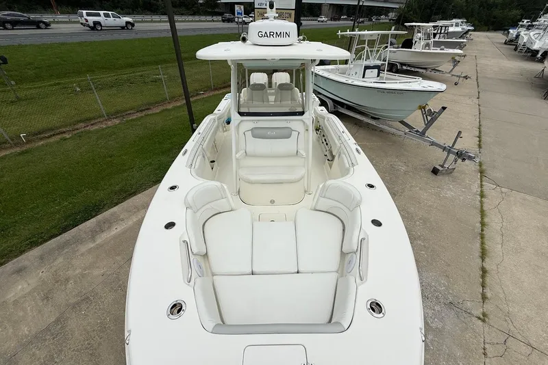 Slide: The Image of 2023 Key West 263 FS boat with Garmin equipment, parked on a concrete lot. - 28